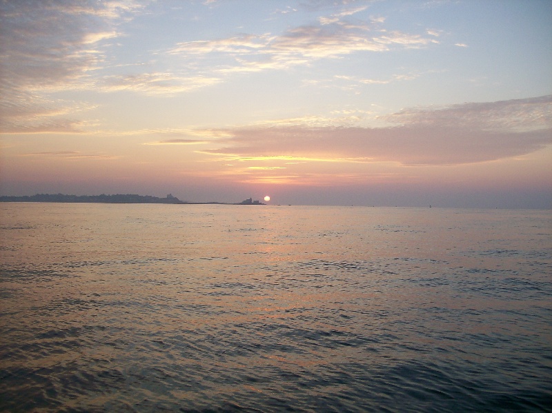 5:00 am sunrise over Watch Hill Light heading for Block Island
