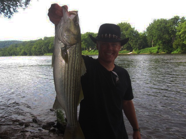 Ken Beam catches a nice Striper in the Delaware River